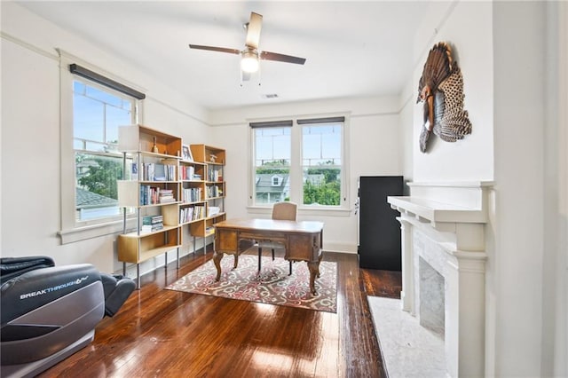 home office featuring ceiling fan, dark hardwood / wood-style floors, and a healthy amount of sunlight