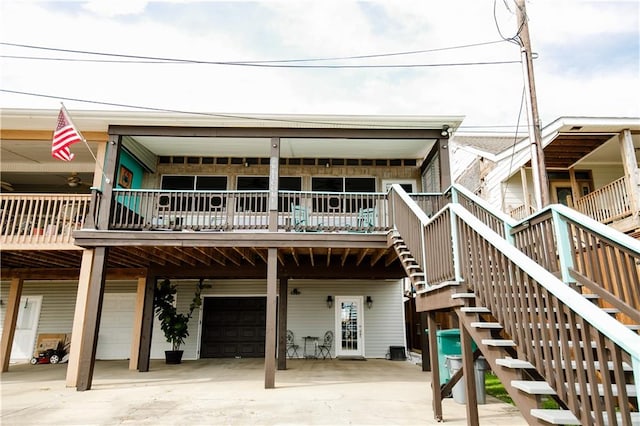 rear view of property featuring a garage