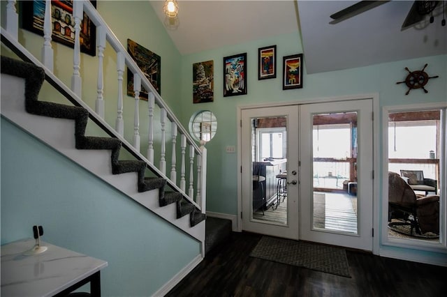 foyer with lofted ceiling, french doors, and dark hardwood / wood-style flooring