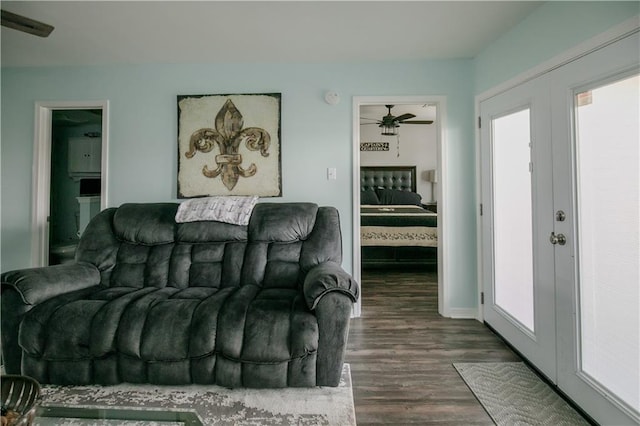 living room with french doors, ceiling fan, and dark hardwood / wood-style flooring