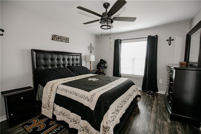 bedroom with dark wood-type flooring and ceiling fan