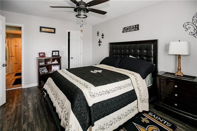 bedroom with dark hardwood / wood-style floors, ensuite bath, and ceiling fan