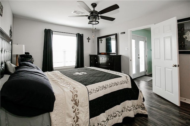 bedroom featuring french doors, dark hardwood / wood-style floors, and ceiling fan