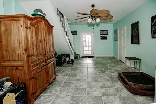 interior space featuring ceiling fan