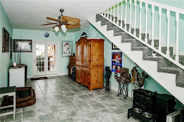 interior space with ceiling fan