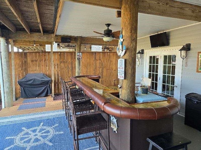 view of patio featuring french doors, ceiling fan, and a grill