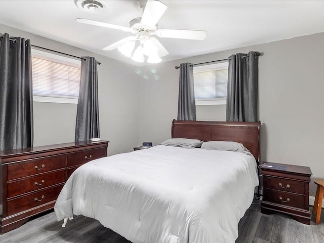 bedroom with ceiling fan and hardwood / wood-style flooring