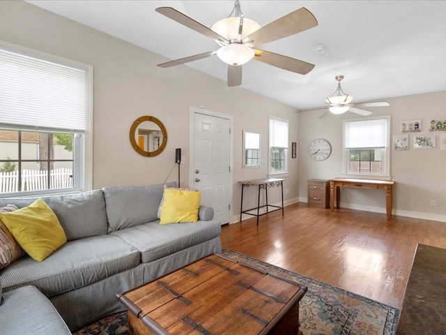 living room with hardwood / wood-style flooring, a wealth of natural light, and ceiling fan