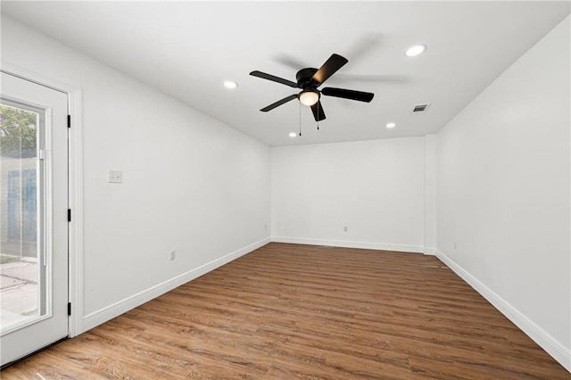 spare room featuring ceiling fan and wood-type flooring