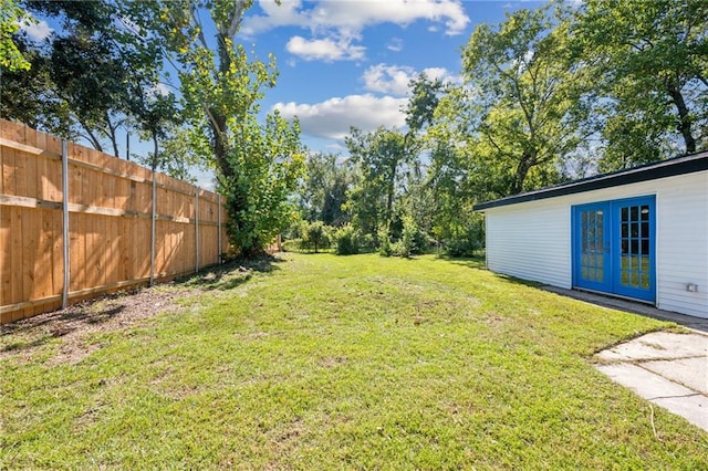 view of yard featuring french doors