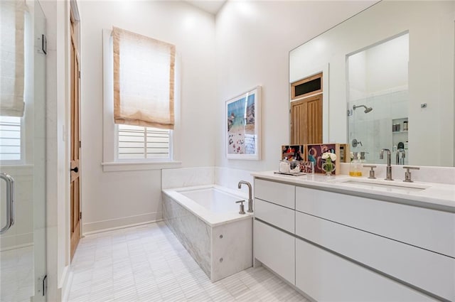 bathroom featuring vanity, shower with separate bathtub, and tile patterned floors