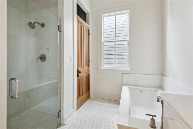 bathroom with tile patterned flooring, vanity, and plus walk in shower