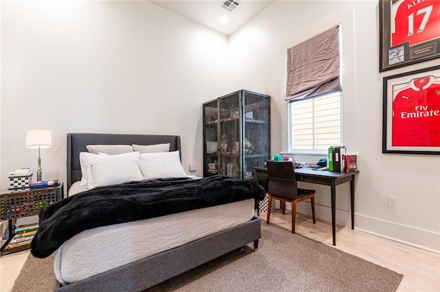 bedroom featuring hardwood / wood-style floors