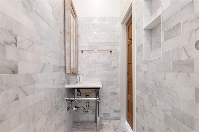 bathroom with a tile shower