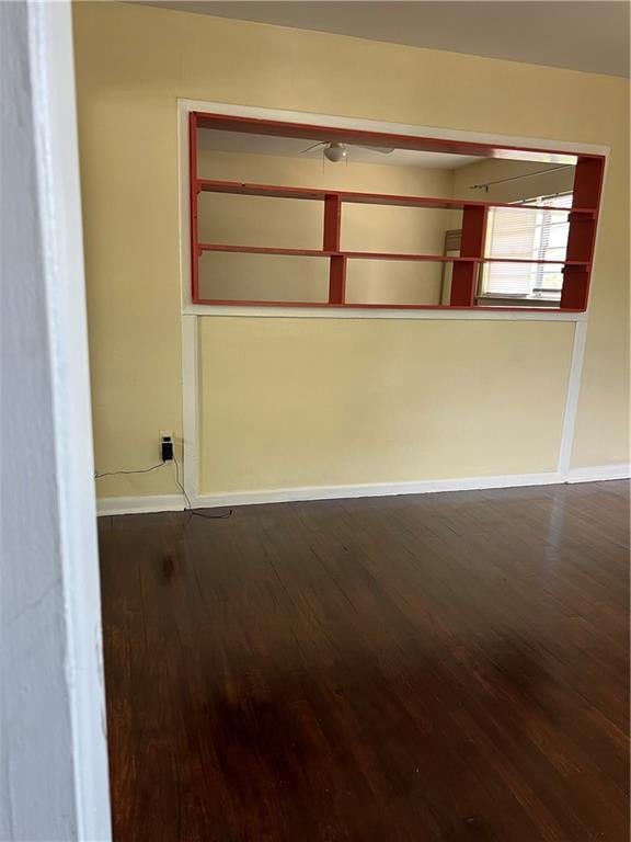 spare room featuring dark hardwood / wood-style flooring