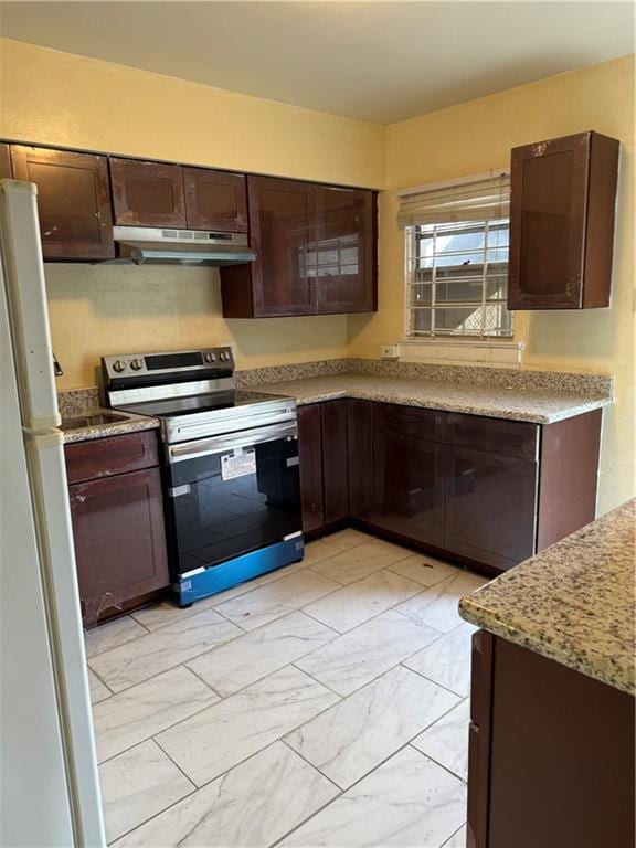 kitchen with stainless steel electric stove, dark brown cabinetry, light stone countertops, and white fridge