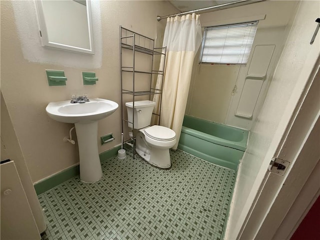 bathroom with toilet and shower / bath combo with shower curtain