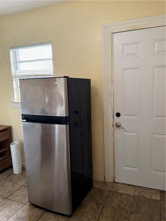 kitchen featuring stainless steel refrigerator