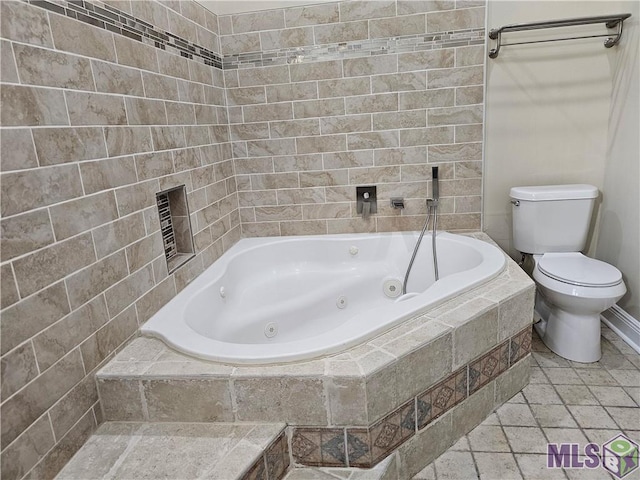 3019 Eagle St, New Orleans, LA 70118 - full bath featuring a tub with jets, toilet, stone tile flooring, and baseboards