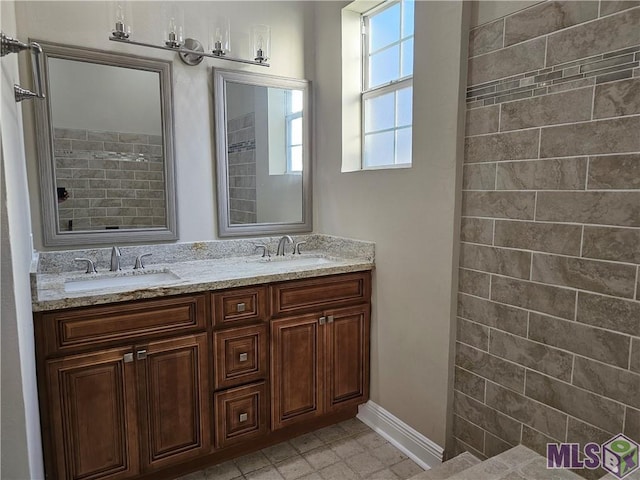 3019 Eagle St, New Orleans, LA 70118 - full bath with double vanity and baseboards