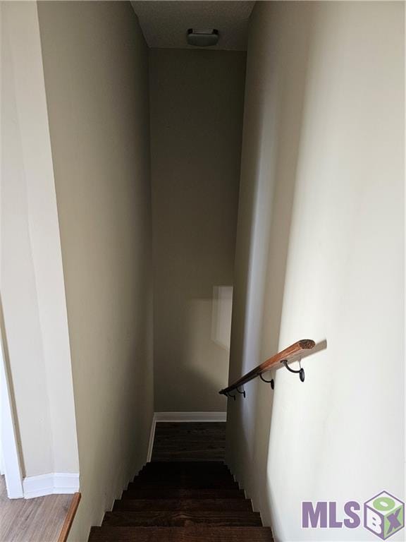 3019 Eagle St, New Orleans, LA 70118 - stairway with wood finished floors and baseboards