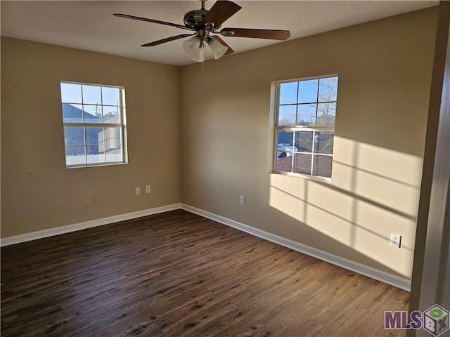 3019 Eagle St, New Orleans, LA 70118 - spare room featuring dark wood-style floors, baseboards, and ceiling fan