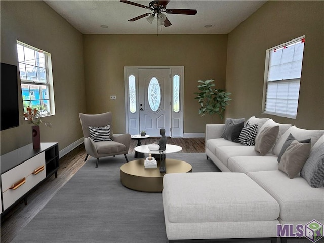 3019 Eagle St, New Orleans, LA 70118 - living area with a ceiling fan, wood finished floors, and baseboards