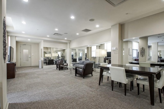 dining area featuring carpet flooring