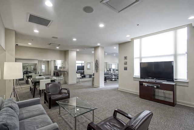 living room with plenty of natural light and carpet