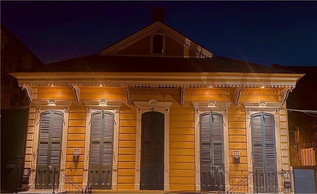 view of exterior entry at night