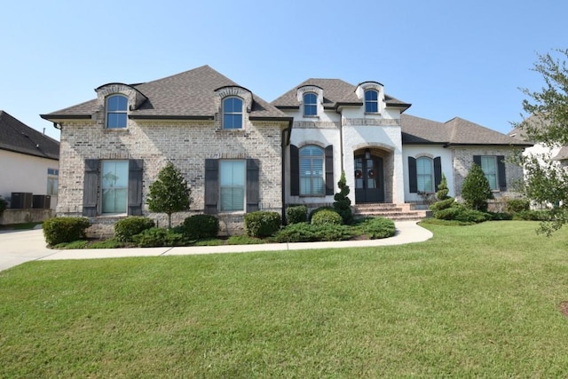 french country home with a front yard