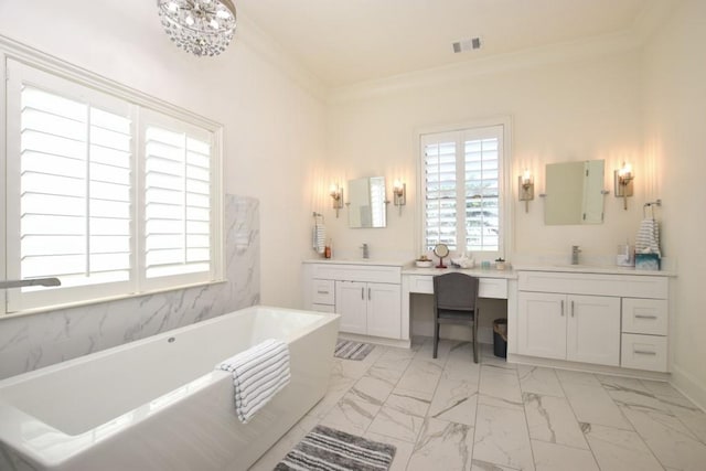 bathroom with a tub to relax in, vanity, a notable chandelier, and ornamental molding