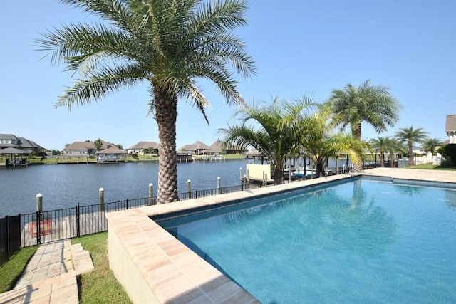 view of pool with a water view