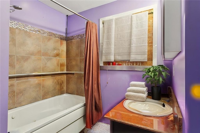 bathroom featuring shower / tub combo and vanity