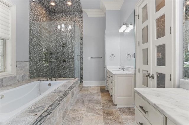 bathroom featuring independent shower and bath, vanity, and ornamental molding