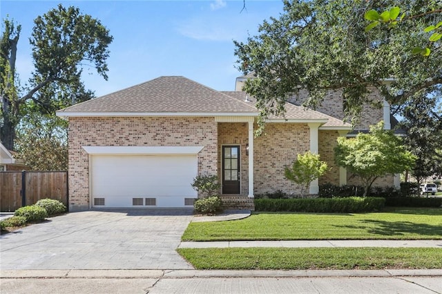 ranch-style house featuring a front lawn and a garage