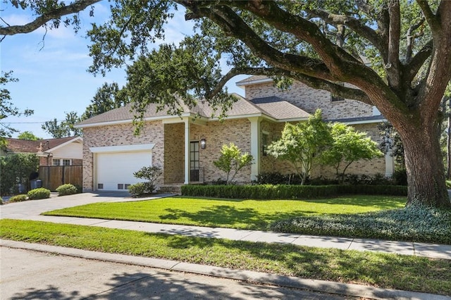 view of front facade featuring a front lawn and a garage