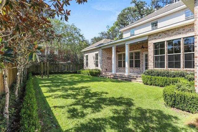 view of yard featuring ceiling fan