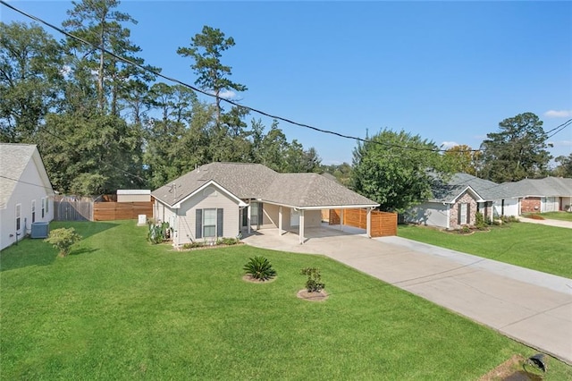 ranch-style house with central air condition unit and a front yard