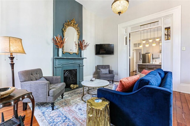 living room with dark hardwood / wood-style flooring