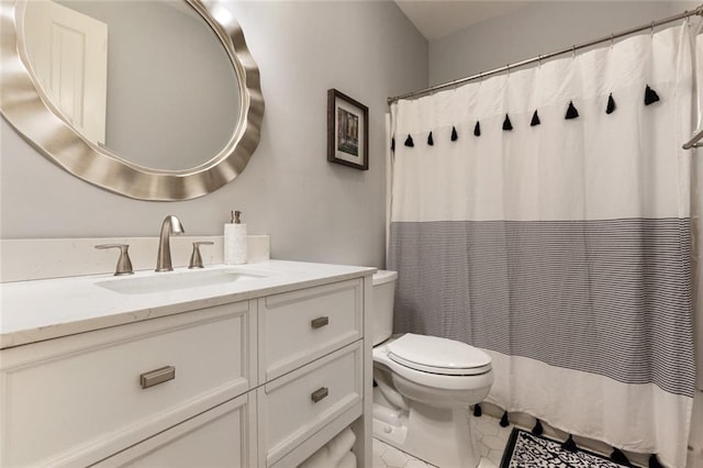 bathroom with curtained shower, tile patterned flooring, vanity, and toilet