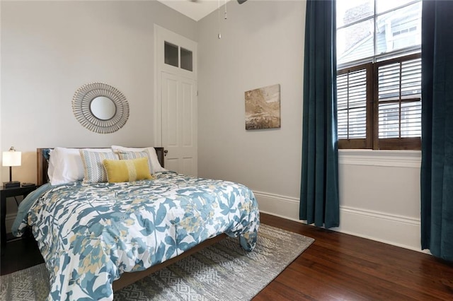 bedroom featuring dark wood-type flooring