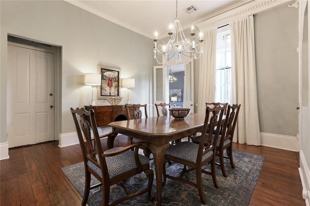 dining room with a chandelier, dark hardwood / wood-style floors, and ornamental molding