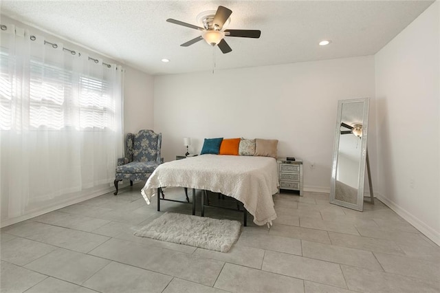 tiled bedroom with ceiling fan