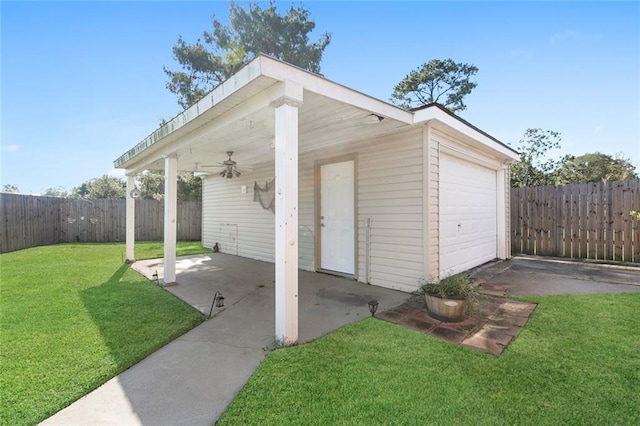 view of outbuilding with a yard