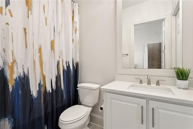 bathroom with toilet and vanity