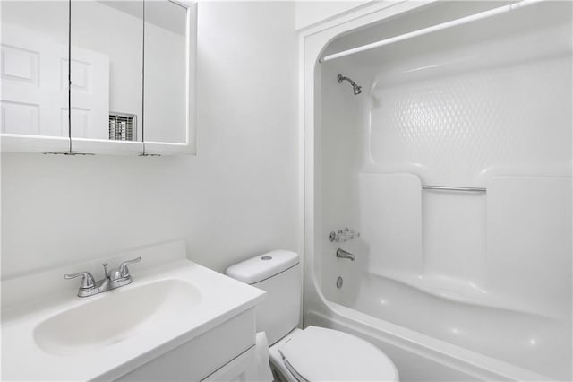 full bathroom featuring bathtub / shower combination, vanity, and toilet