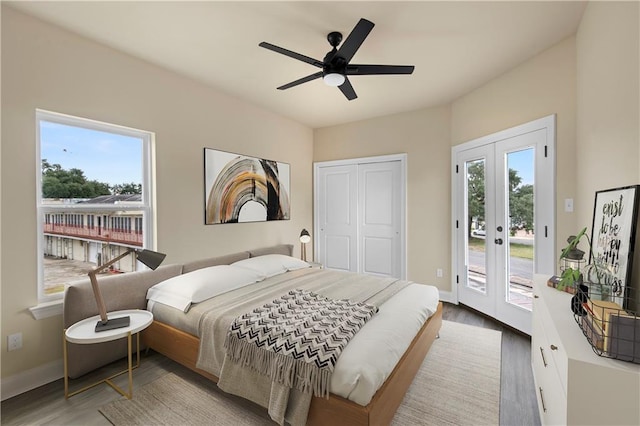 bedroom with access to exterior, ceiling fan, french doors, and wood-type flooring