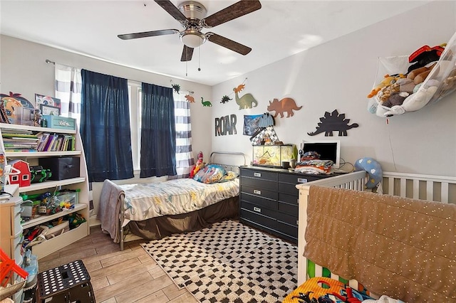 bedroom featuring ceiling fan and light hardwood / wood-style floors