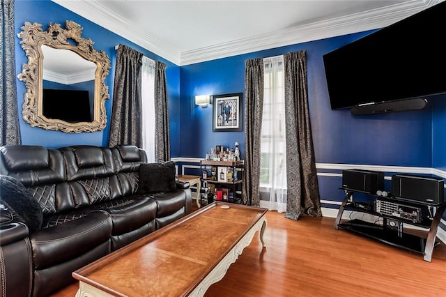 living room featuring crown molding and wood-type flooring